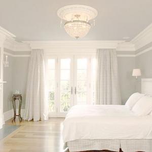 white-english-country-house-bedroom-with-crown-molding.jpg